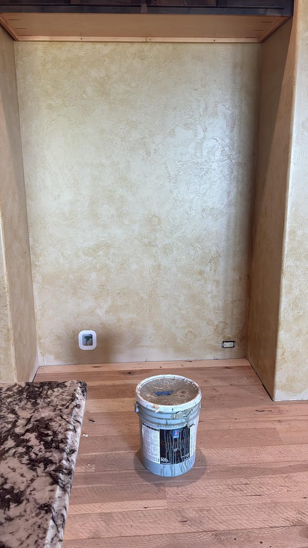 Close view of a mottled plaster wall finish